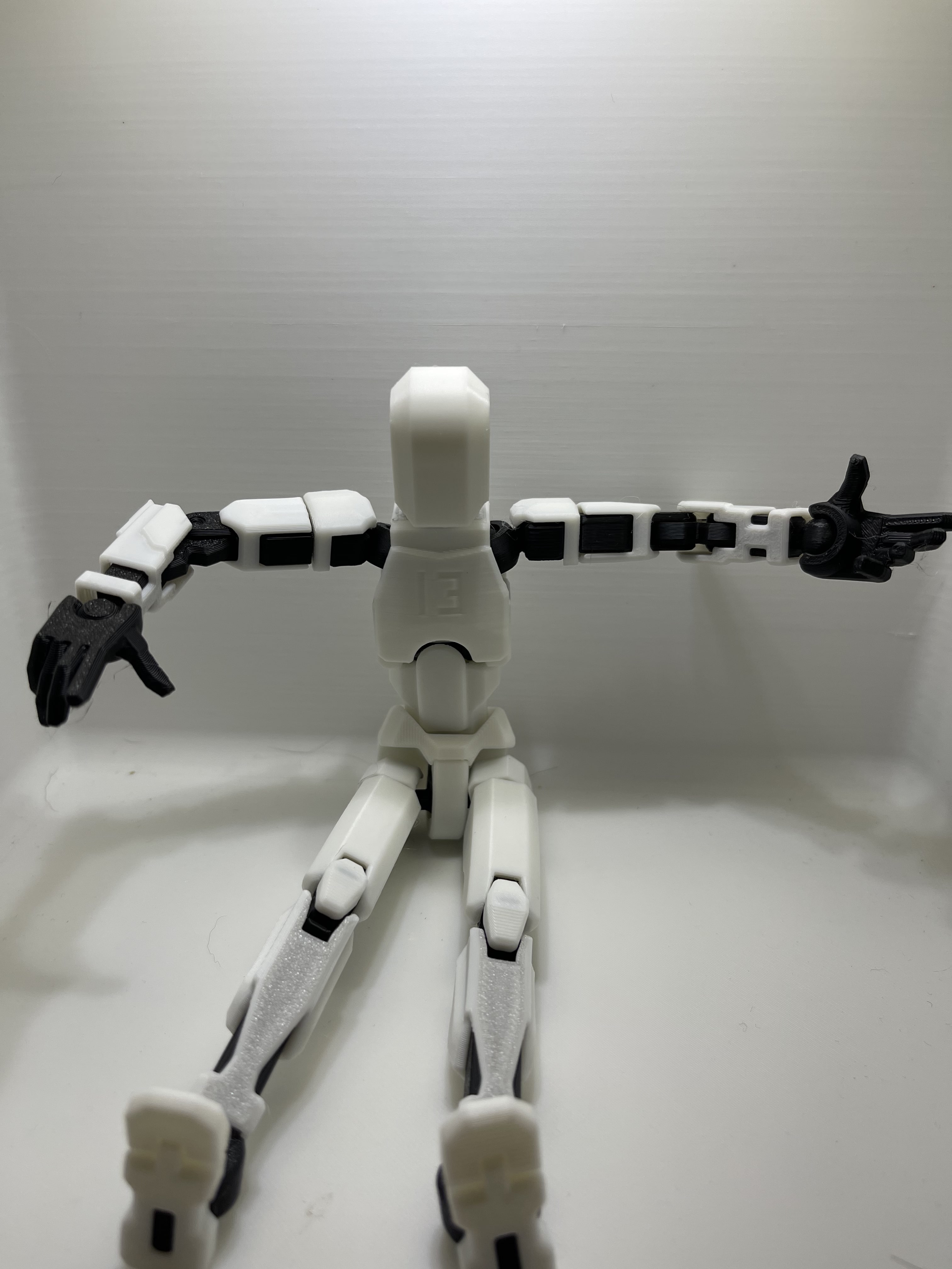 black and mostly white tesla robot